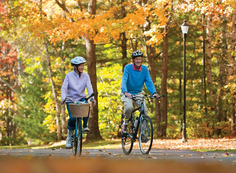 Thornton Oaks' residents biking in autumn.